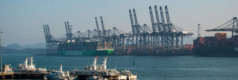 container ships docked at bustling cargo port